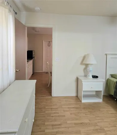 a bedroom with a bed and a table in it