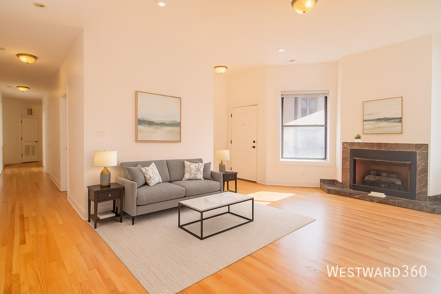 5172 South Michigan Avenue, Unit 1 Chicago, IL 60615 - Photo 11 of 14 a living room with furniture a fireplace and a wooden floor