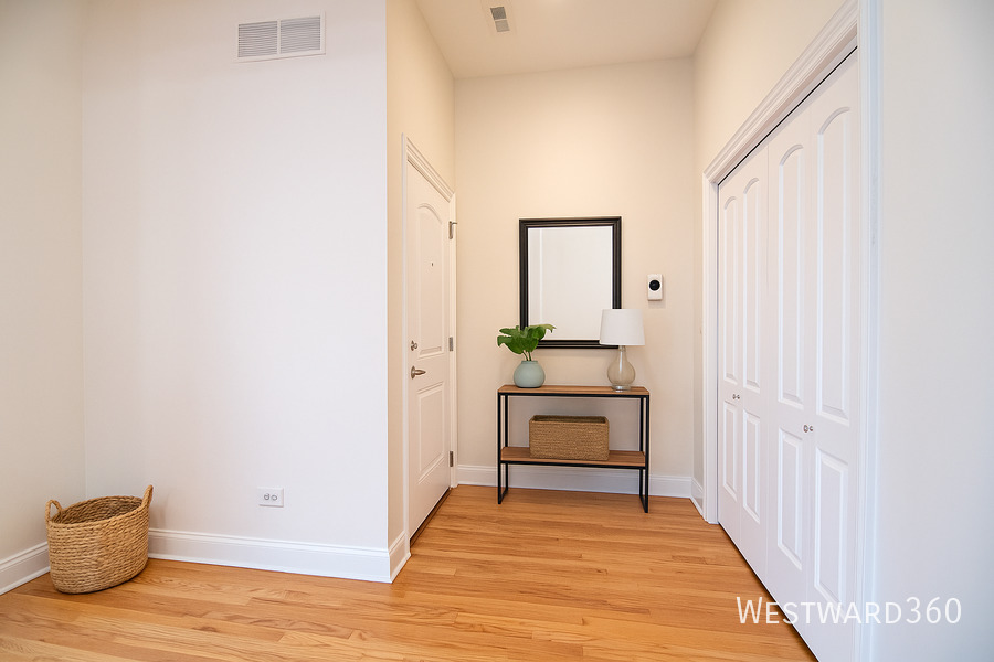 5172 South Michigan Avenue, Unit 1 Chicago, IL 60615 - Photo 3 of 14 a view of a room with wooden floor and cabinet