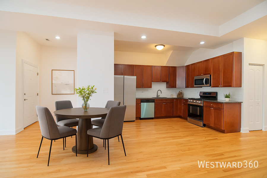 5172 South Michigan Avenue, Unit 1 Chicago, IL 60615 - Photo 4 of 14 a kitchen with stainless steel appliances kitchen island granite countertop a kitchen island a stove a sink a dining table and chairs