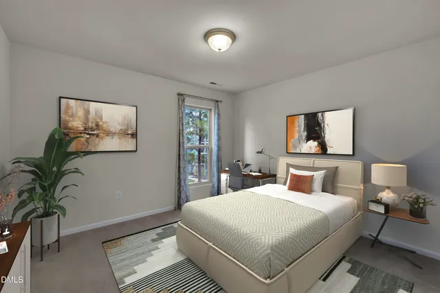 a bedroom with a large bed and a potted plant