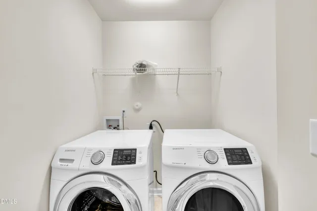 a view of washer and dryer in a utility room