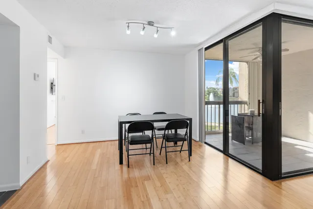 a view of room with furniture and wooden floor