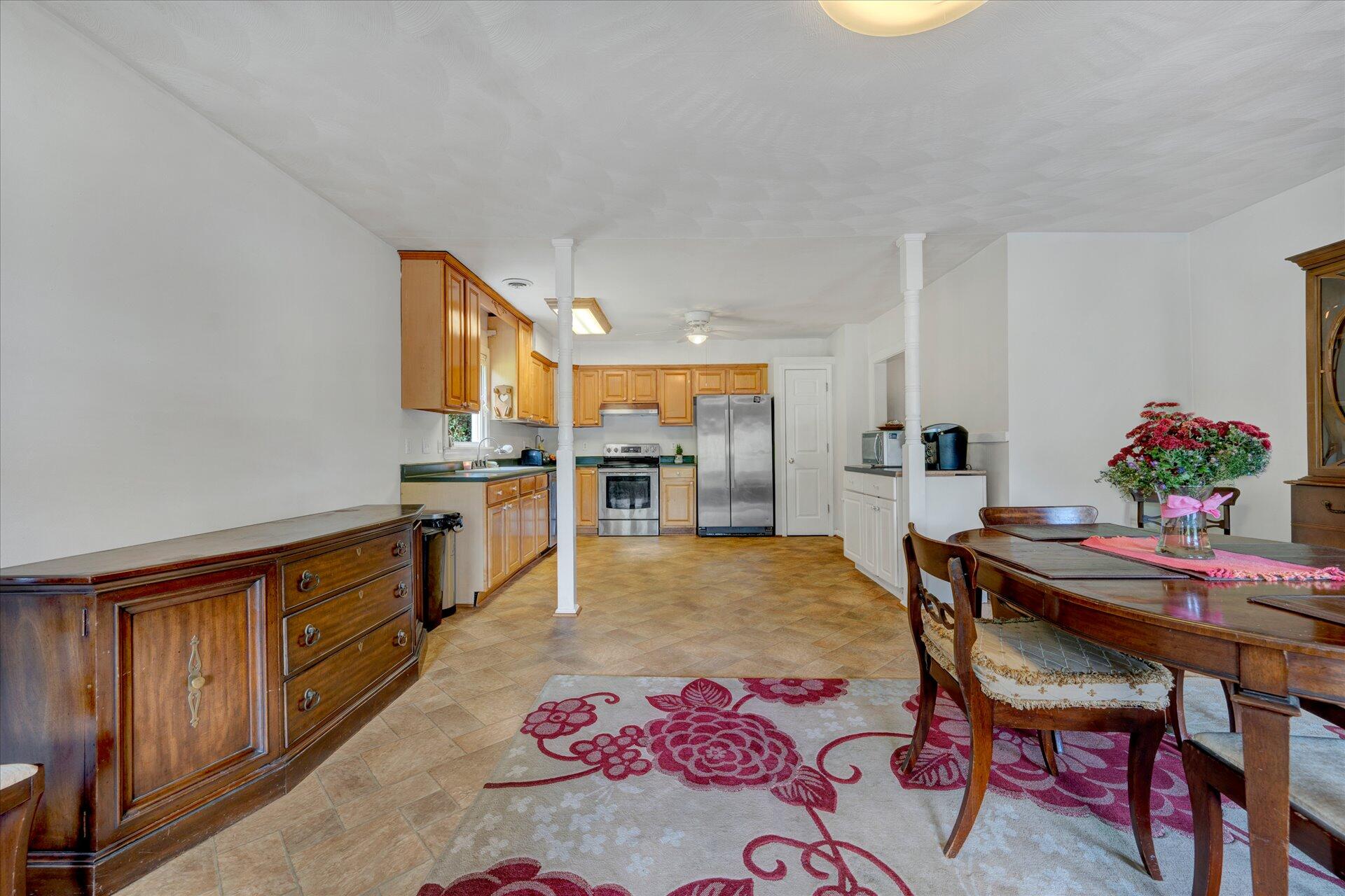 5931 Brethren Road Roanoke, VA 24014 - Photo 14 of 43 a kitchen with a table and chairs in it