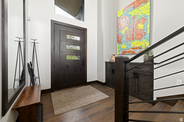 11547 Soaring Hawk Lane Hideout, UT 84036 - Photo 30 of 43 Modern entryway featuring a dark wood-finish door with three horizontal lites, a transom window, and rich wood-finish flooring