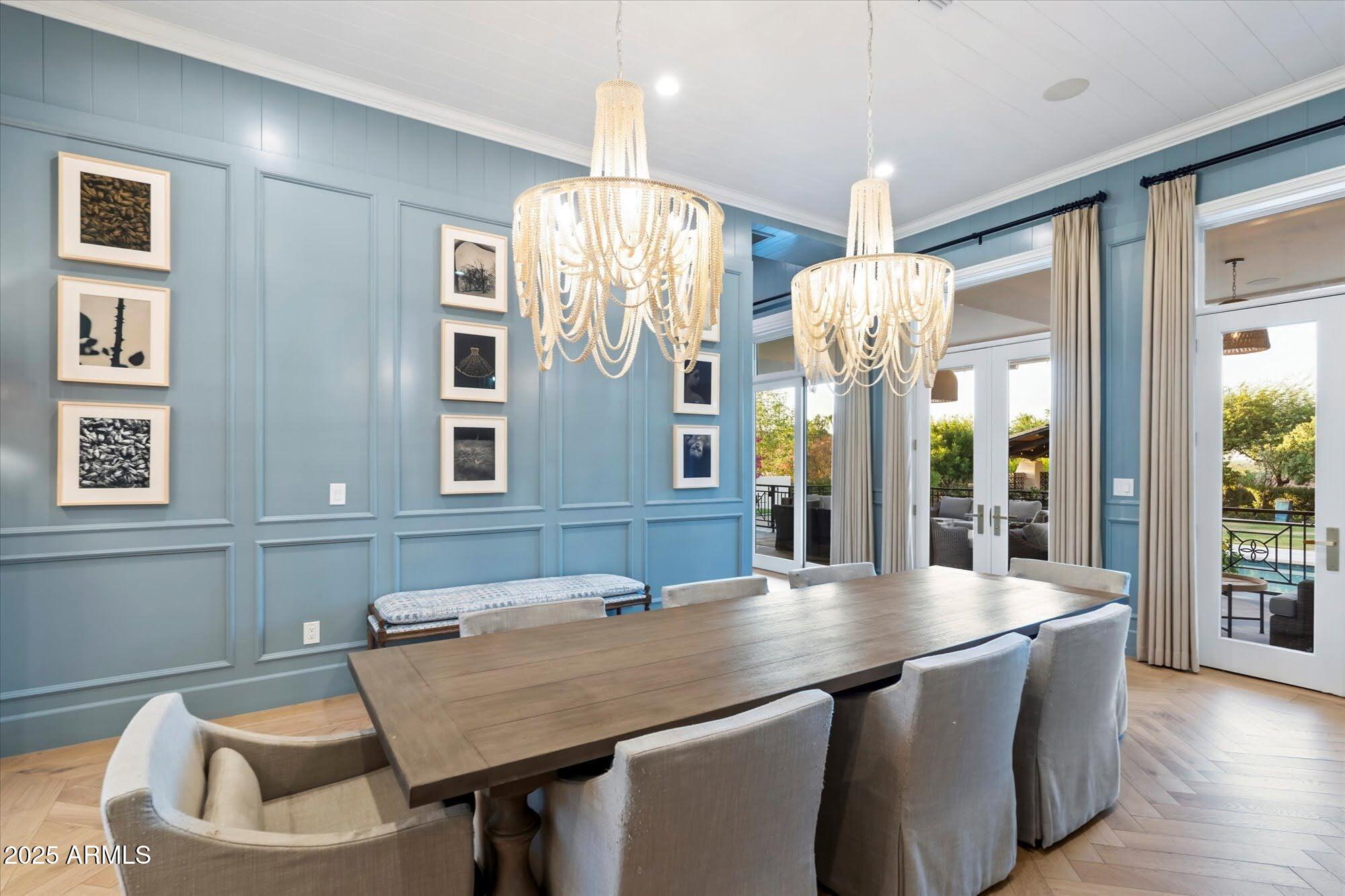 5226 East Desert Vista Road Paradise Valley, AZ 85253 - Photo 13 of 49 a kitchen with a table chairs and chandelier