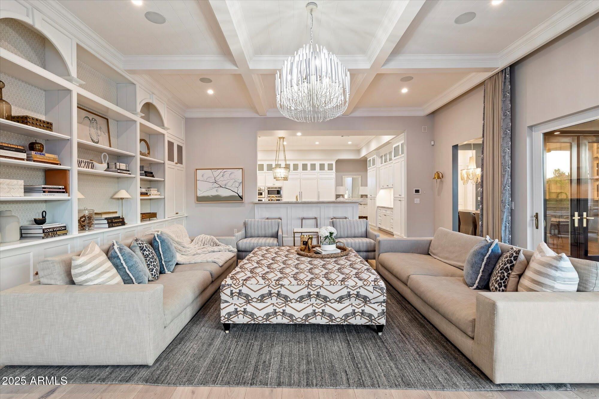 5226 East Desert Vista Road Paradise Valley, AZ 85253 - Photo 20 of 49 a living room with furniture and a chandelier