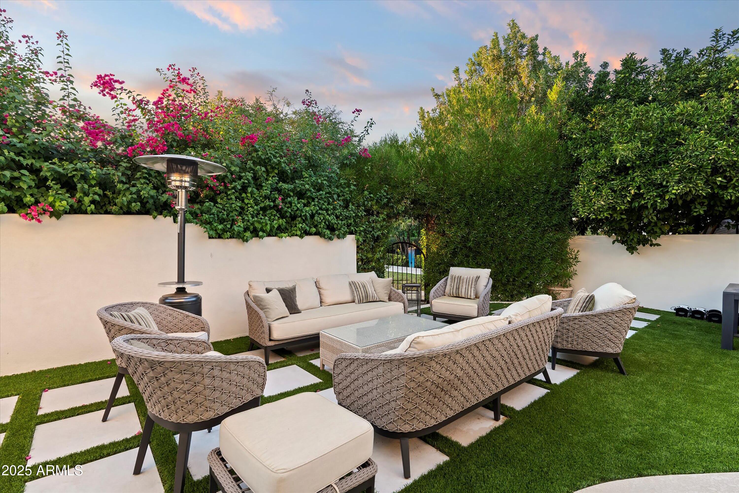 5226 East Desert Vista Road Paradise Valley, AZ 85253 - Photo 40 of 49 a view of a patio with couches chairs and a potted plant