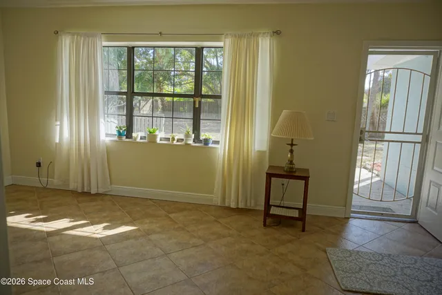 a bedroom with a bed and a table