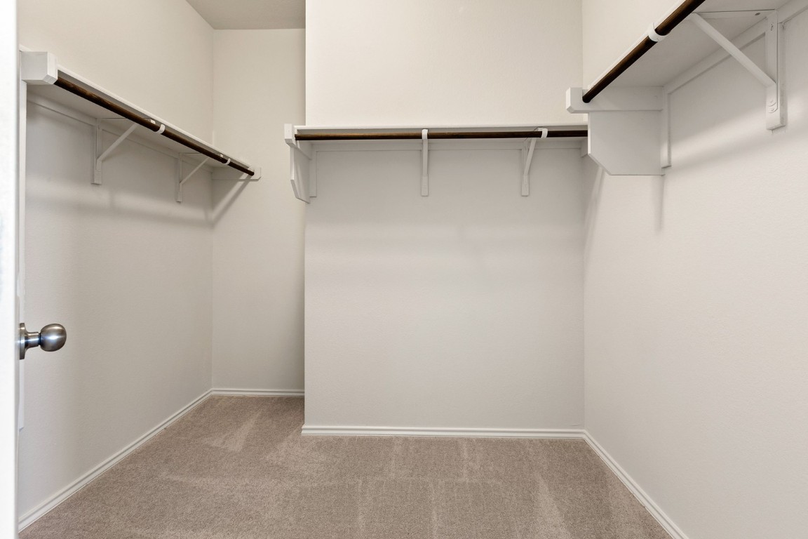 500 Martha Drive Buda, TX 78610 - Photo 6 of 7 Spacious closet featuring light colored carpet
