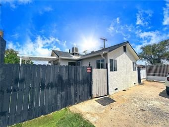 15962 M Street, Unit A Mojave, CA 93501 - Photo 2 of 21 a view of backyard with wooden fence