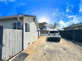 a front view of a house with parking space