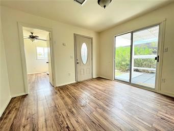 15962 M Street, Unit A Mojave, CA 93501 - Photo 10 of 21 a view of a livingroom with wooden floor and window