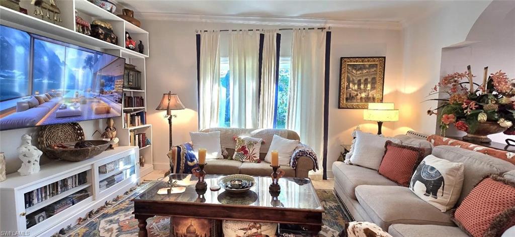 Undisclosed Address Naples, FL 34104 - Photo 15 of 40 Living area featuring ornamental molding