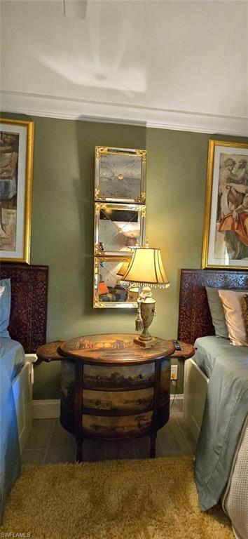 Undisclosed Address Naples, FL 34104 - Photo 38 of 40 Bedroom featuring ornamental molding and baseboards