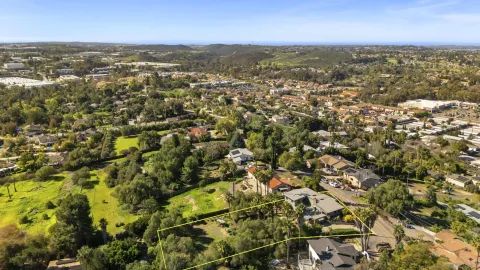 an aerial view of residential building with parking space