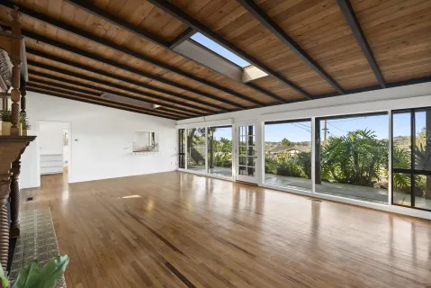 a view of an entryway with wooden floor