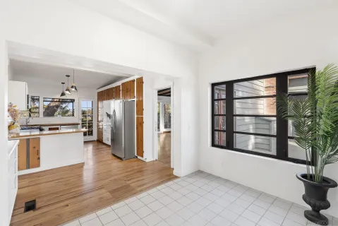 a view of an empty room with closet