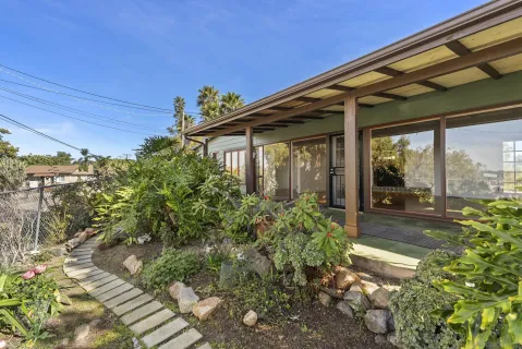 a house with trees in front of it