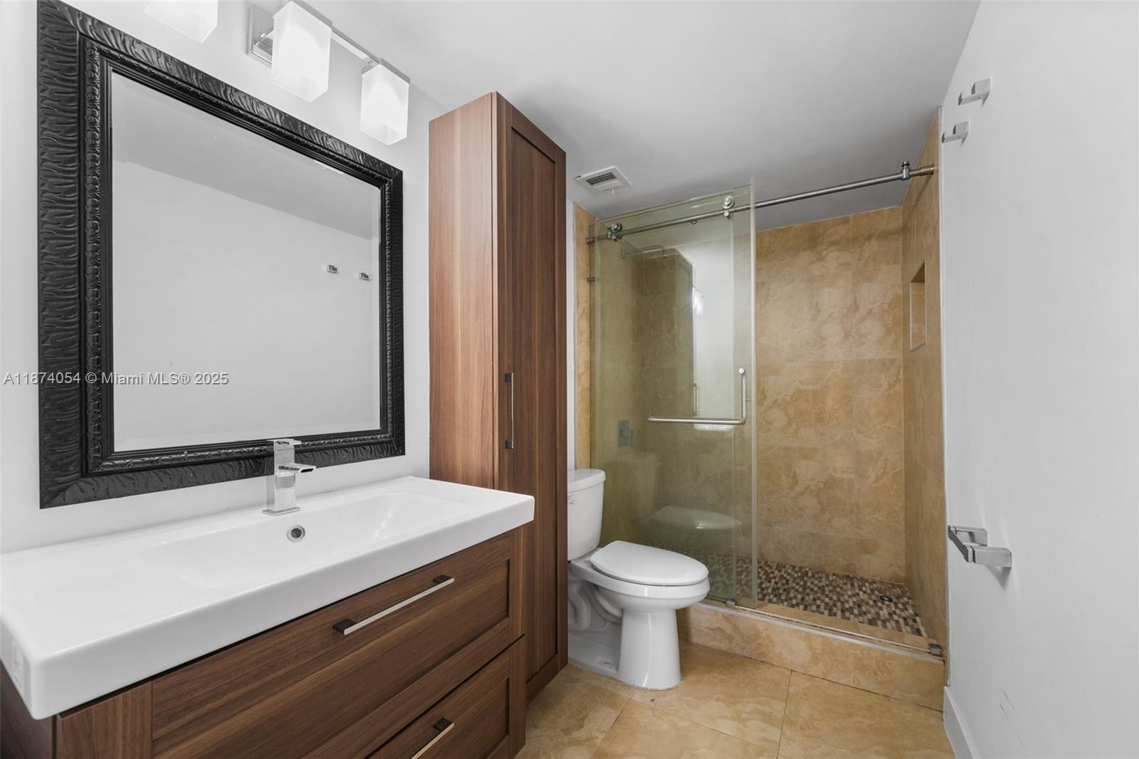 13499 Biscayne Boulevard, Unit 503 North Miami, FL 33181 - Photo 22 of 22 a bathroom with a sink a toilet and shower