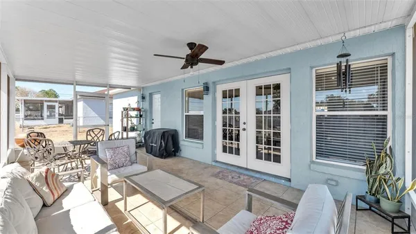 a view of a livingroom with furniture and windows