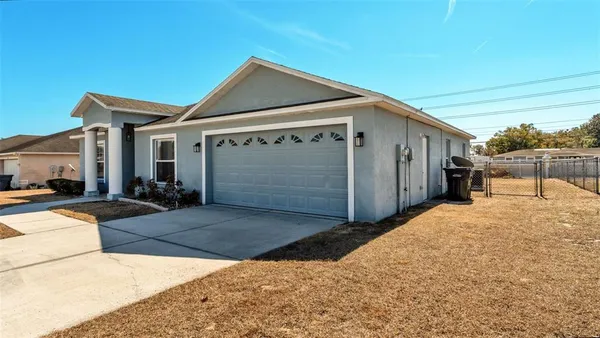 a view of a house with a snow in the yard