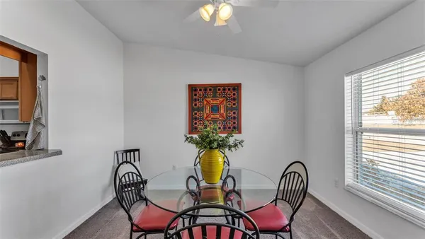 a view of a dining room with furniture window and outside view