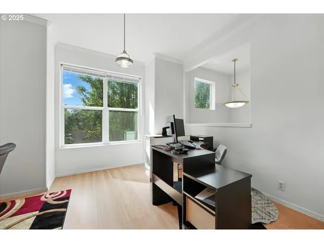 a workspace with furniture and window