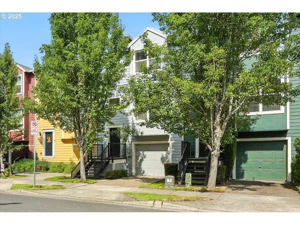 a view of a house with a yard and plants