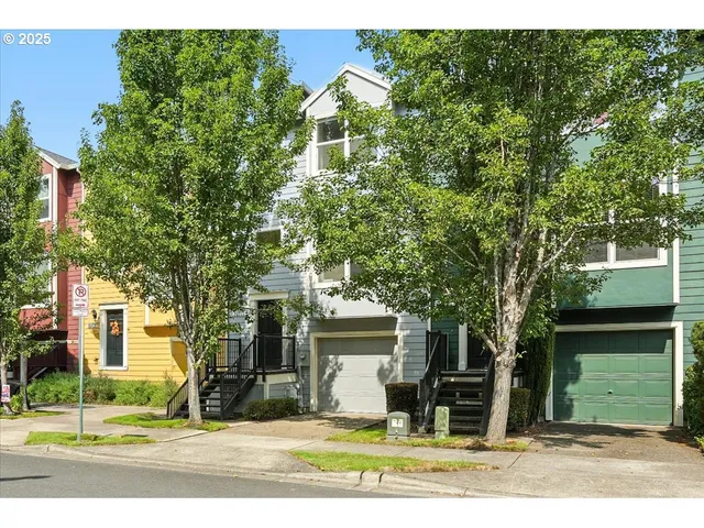 a view of a house with a yard and plants