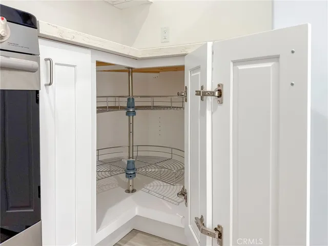 a close view of a sink and cabinets