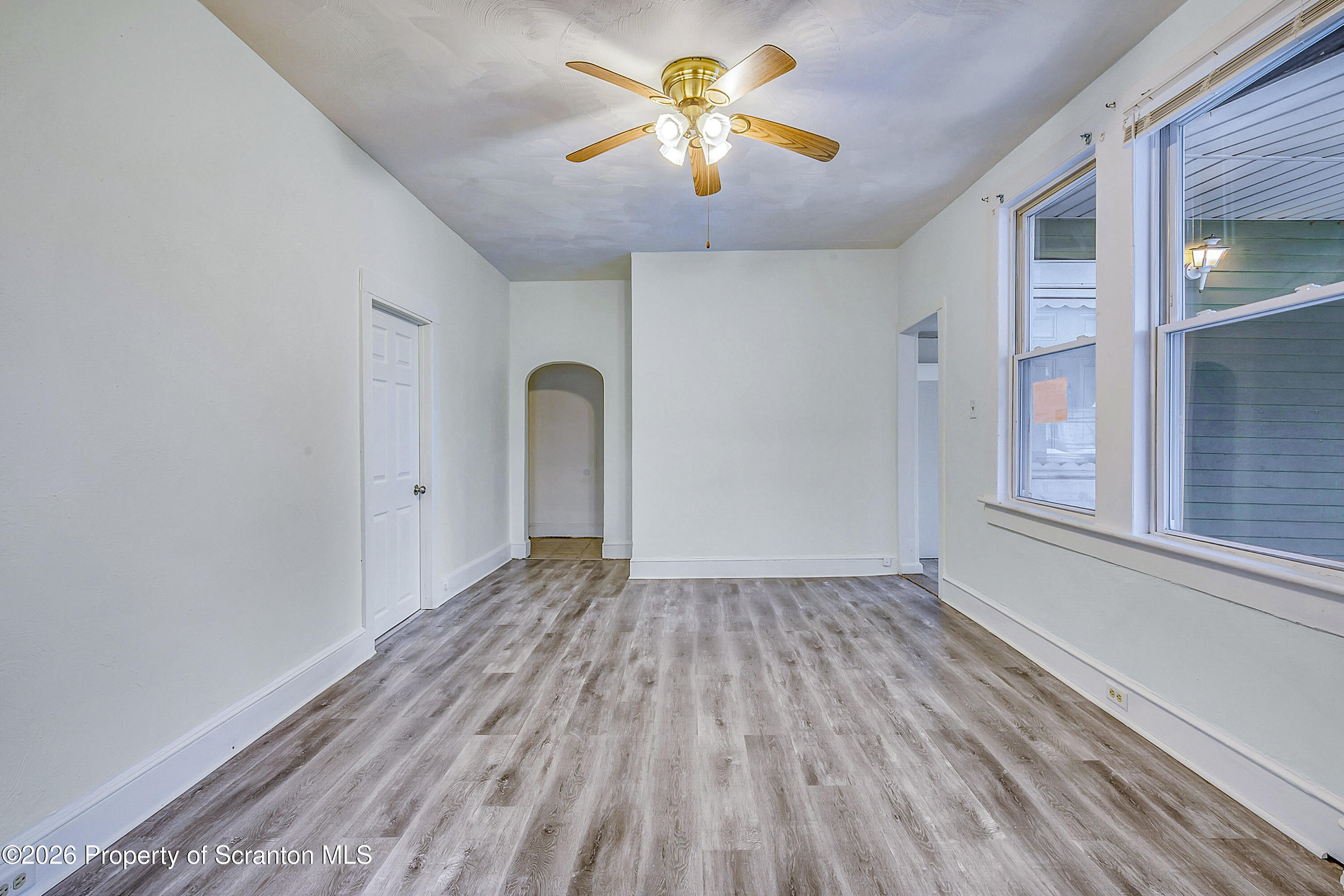 228 North Main Street Taylor, PA 18517 - Photo 11 of 19 a view of room with window and ceiling fan