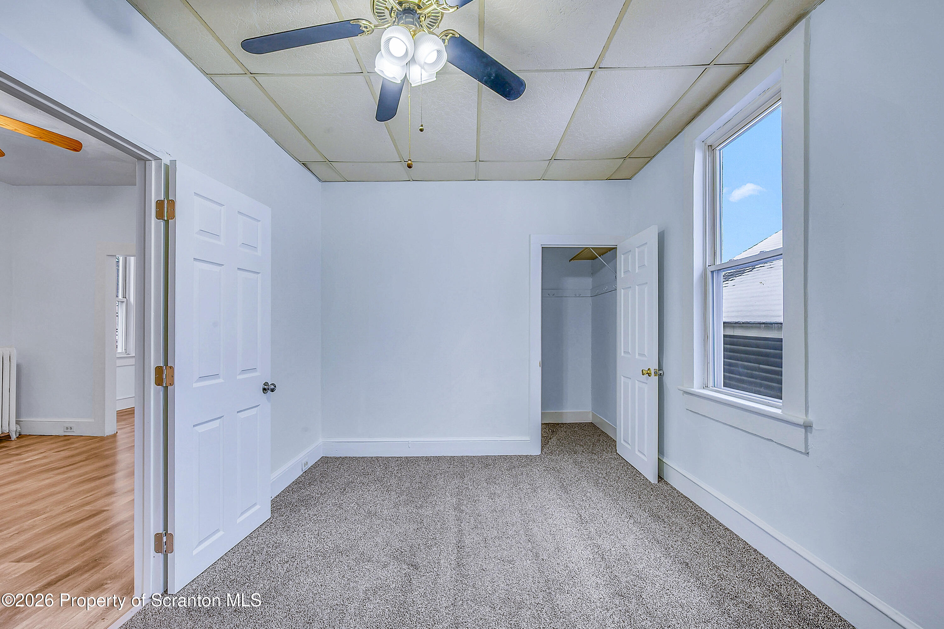228 North Main Street Taylor, PA 18517 - Photo 13 of 19 a view of an empty room with a chandelier fan