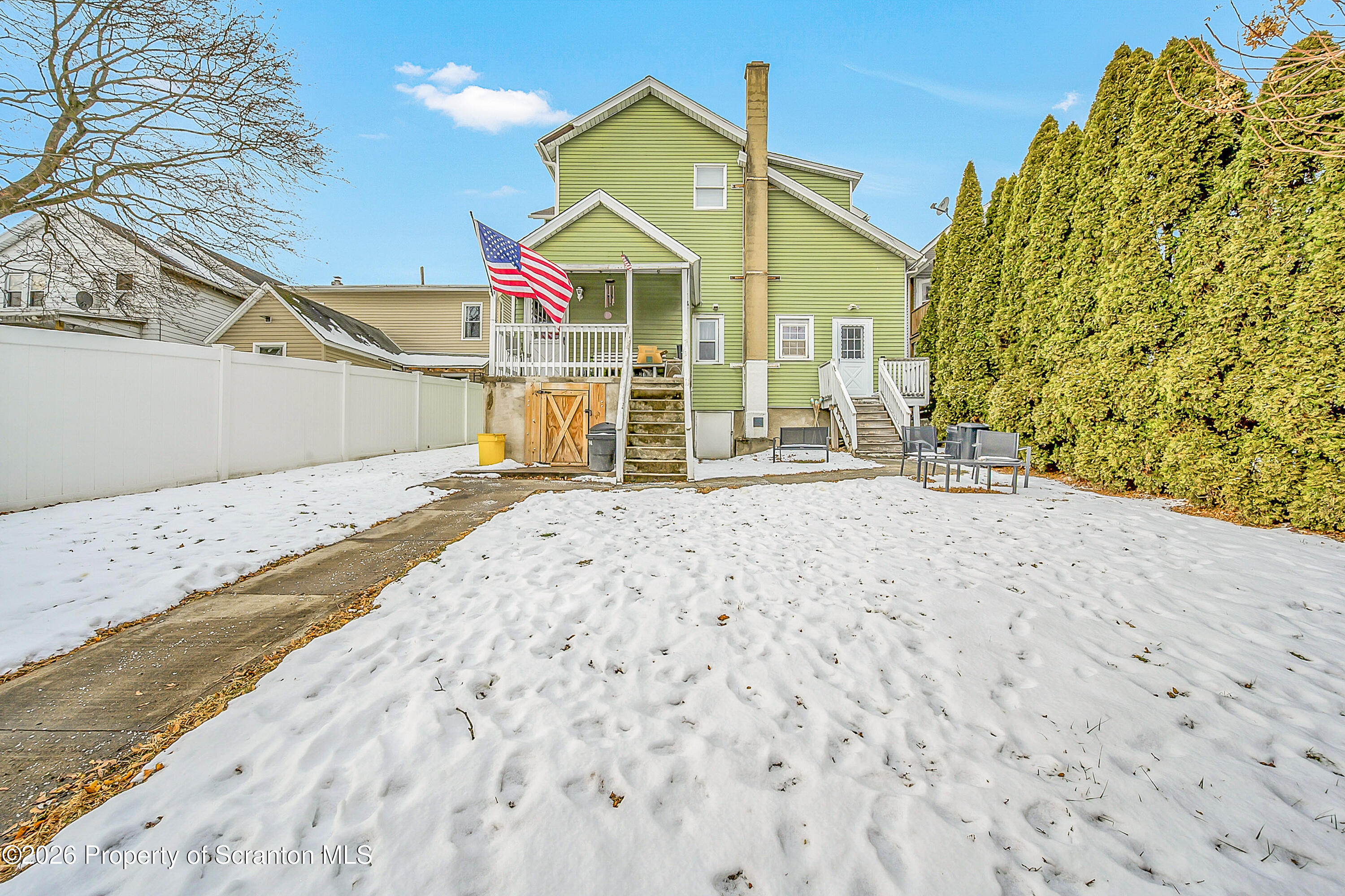 228 North Main Street Taylor, PA 18517 - Photo 19 of 19 a view of a house with a snow on the road