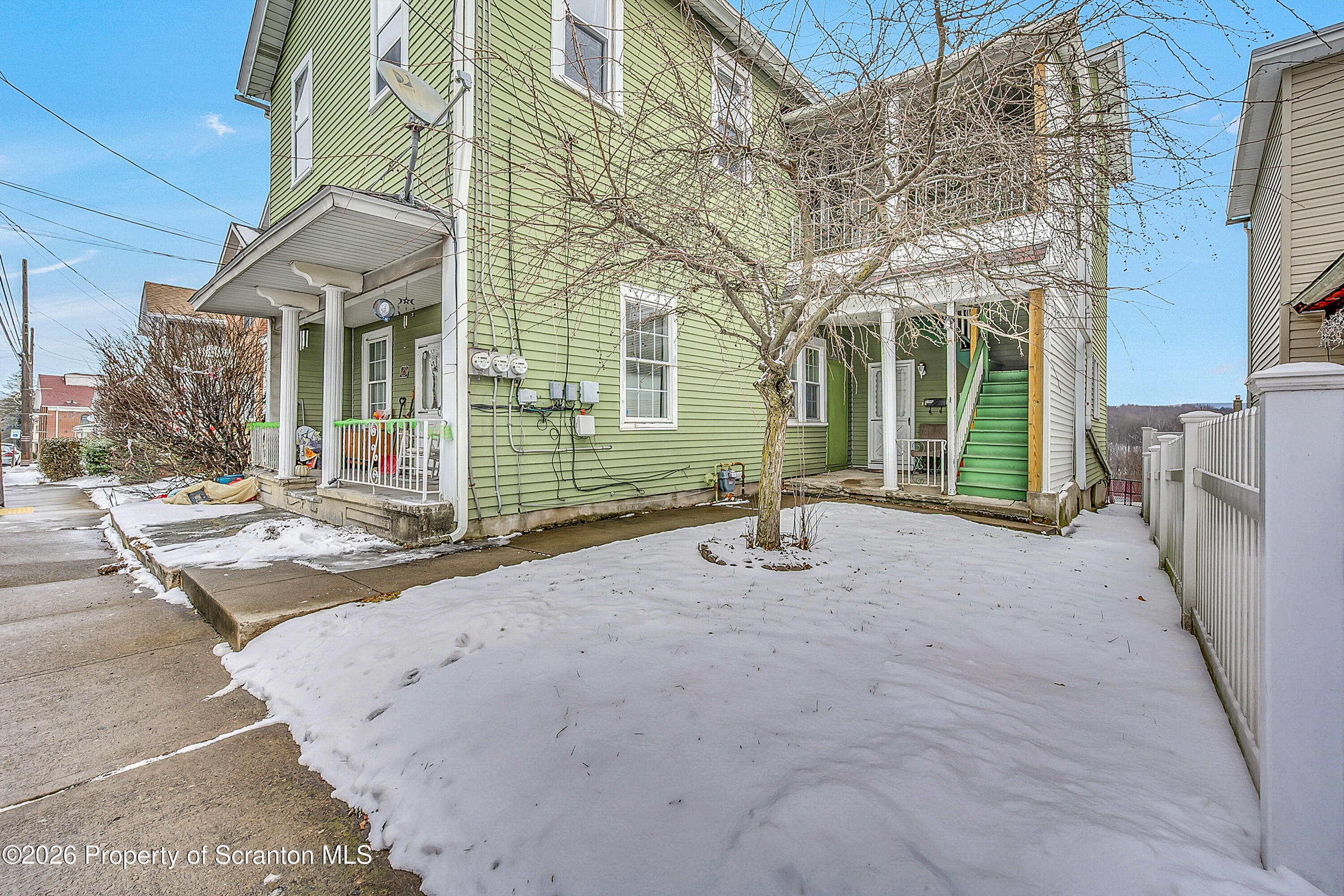 228 North Main Street Taylor, PA 18517 - Photo 2 of 19 a view of a house with brick walls
