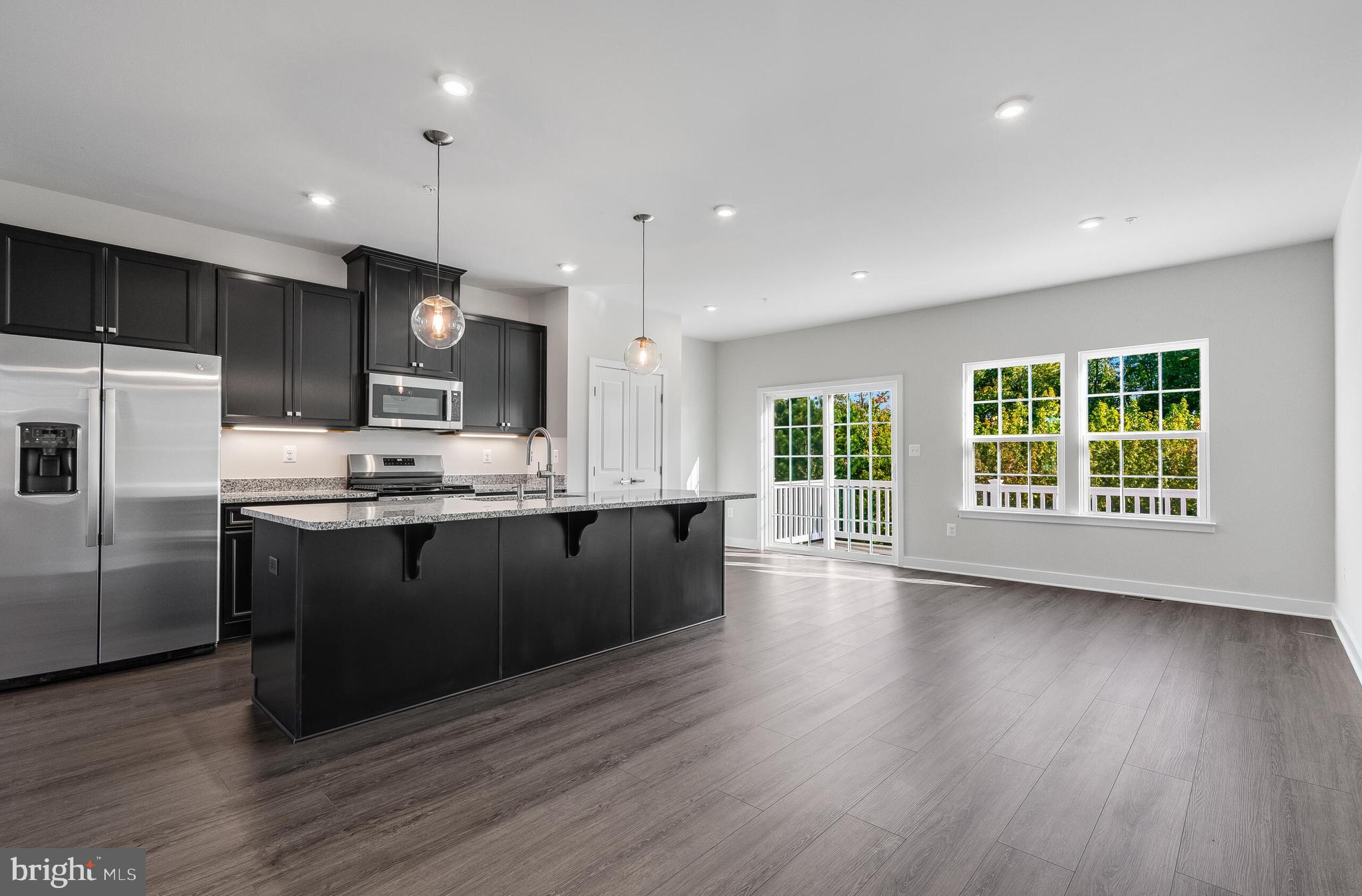 8603 Branch Side Way, Unit B Brandywine, MD 20613 - Photo 7 of 33 MAIN LEVEL KITCHEN W/LARGE CENTER ISLAND