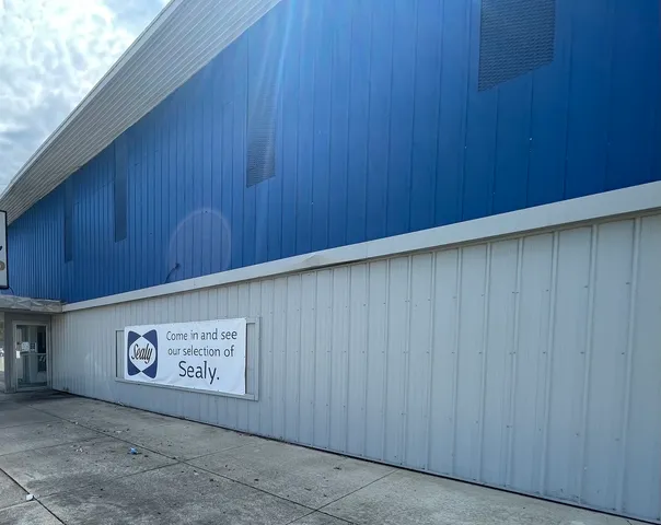 a view of an empty room with a wooden wall