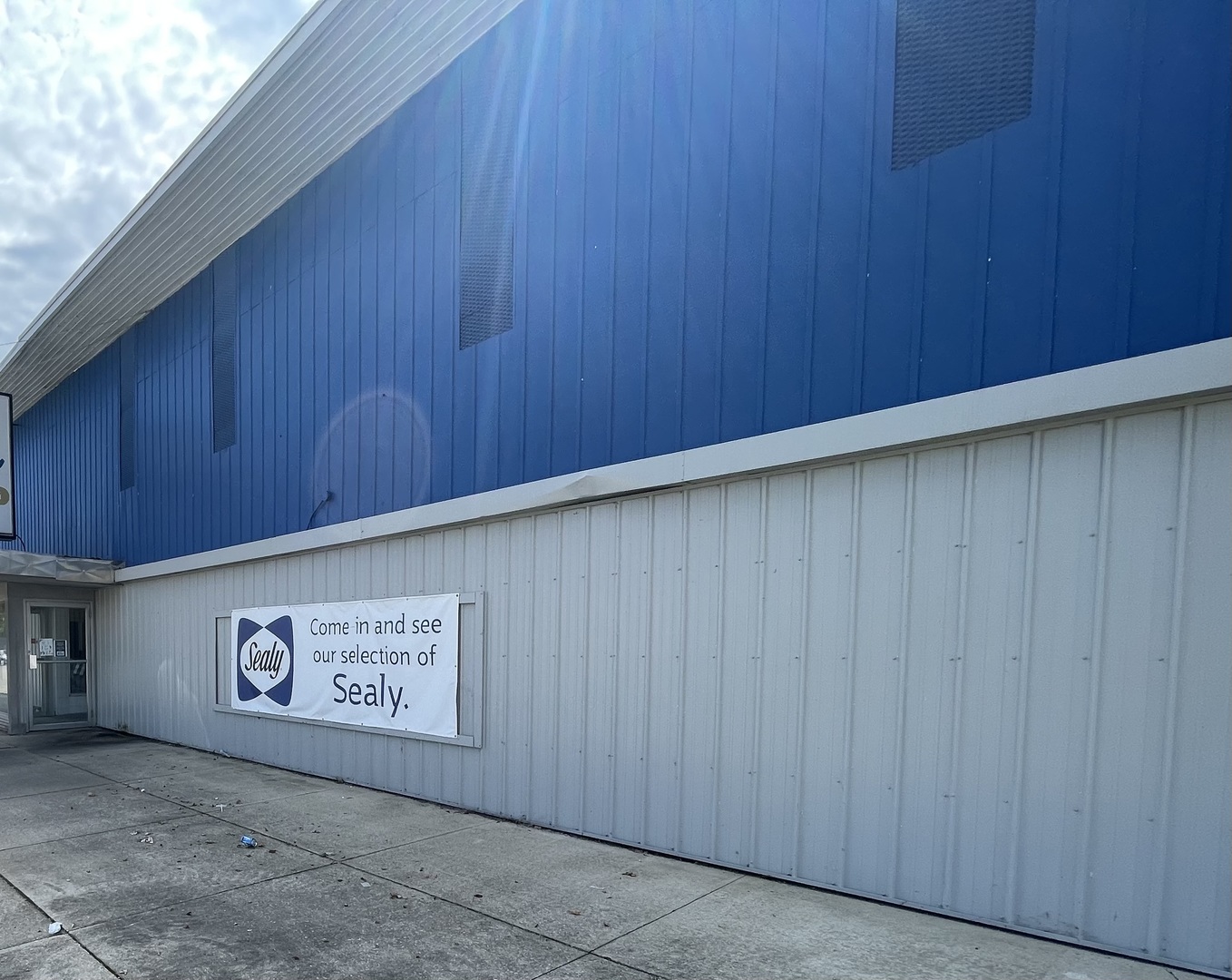 a view of an empty room with a wooden wall
