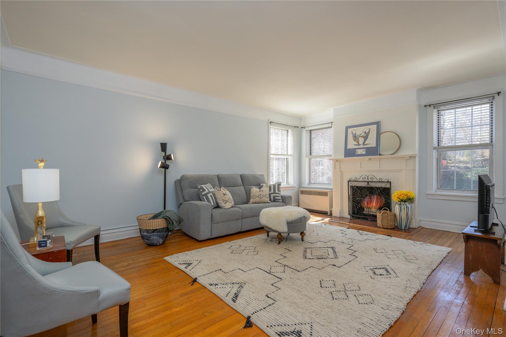 25 Parkview Avenue, Unit 2K Bronxville, NY 10708 - Photo 11 of 26 a living room with furniture and a fireplace
