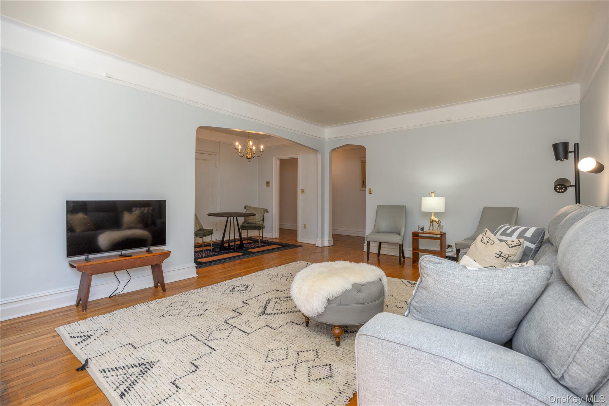 25 Parkview Avenue, Unit 2K Bronxville, NY 10708 - Photo 13 of 26 a living room with furniture and a flat screen tv