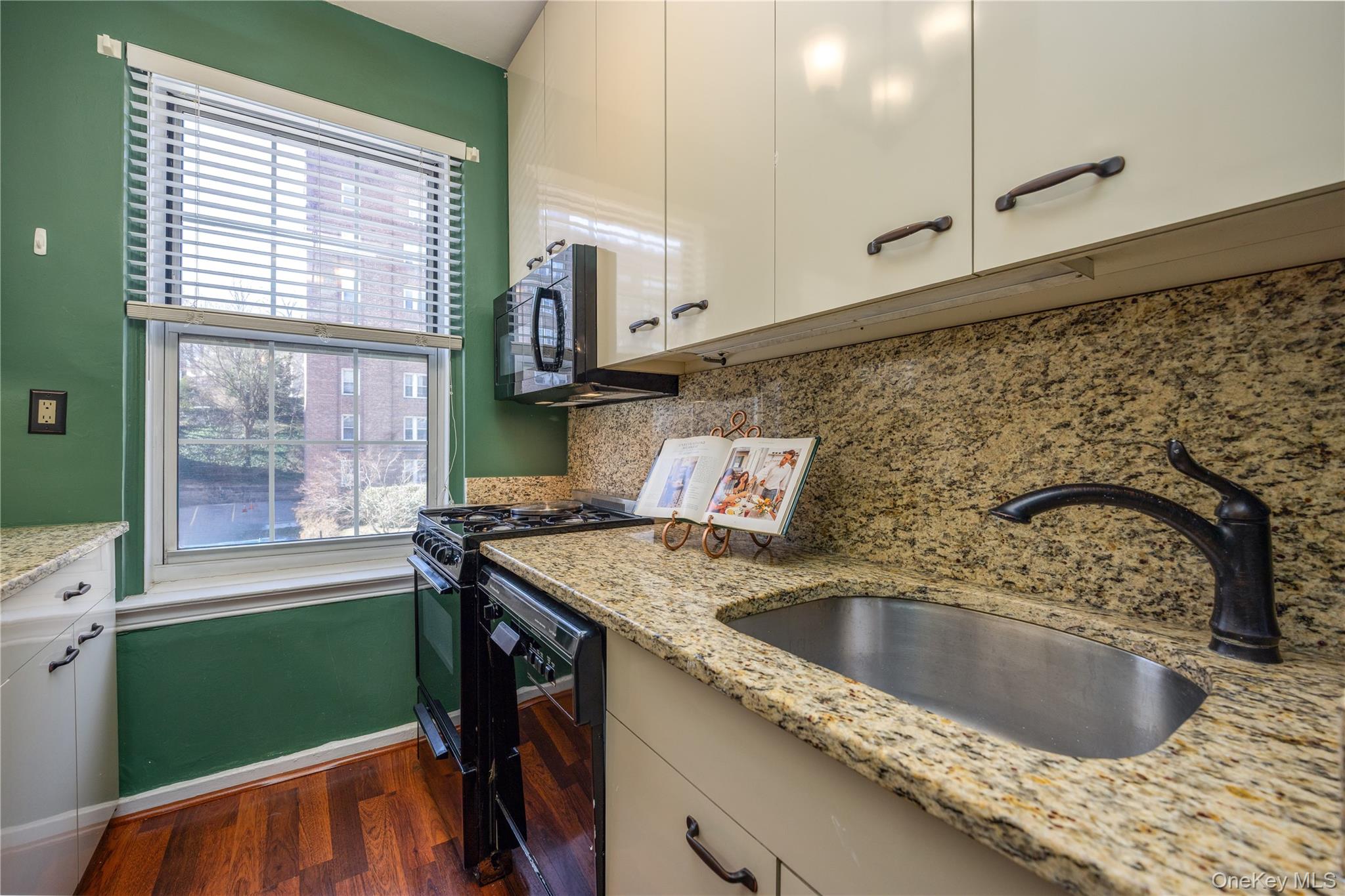 25 Parkview Avenue, Unit 2K Bronxville, NY 10708 - Photo 18 of 26 a kitchen with a sink a counter top space and a window