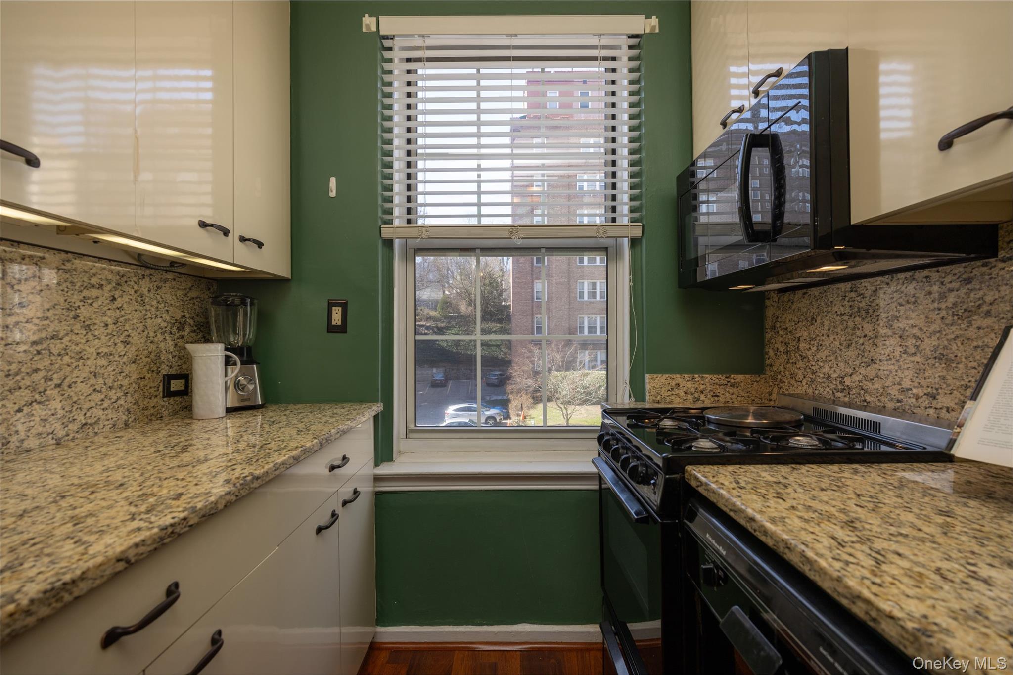 25 Parkview Avenue, Unit 2K Bronxville, NY 10708 - Photo 19 of 26 a kitchen with a sink and a stove