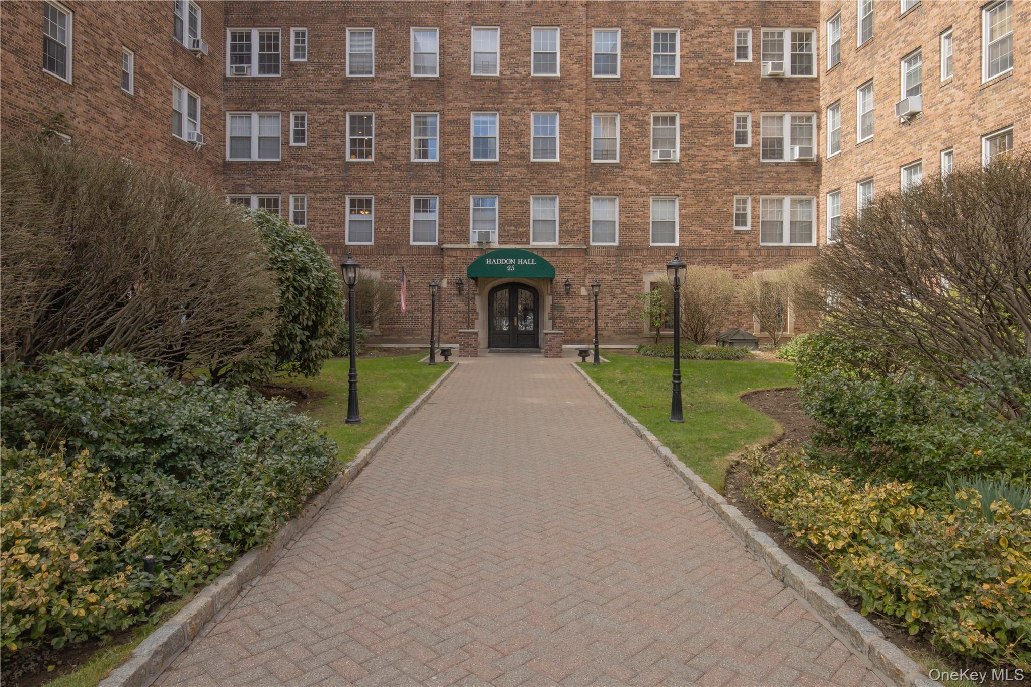 25 Parkview Avenue, Unit 2K Bronxville, NY 10708 - Photo 2 of 26 a view of a brick building next to a yard