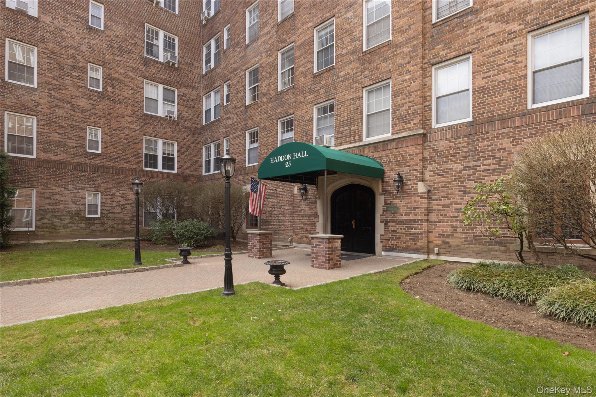 25 Parkview Avenue, Unit 2K Bronxville, NY 10708 - Photo 3 of 26 a view of a brick building with a yard