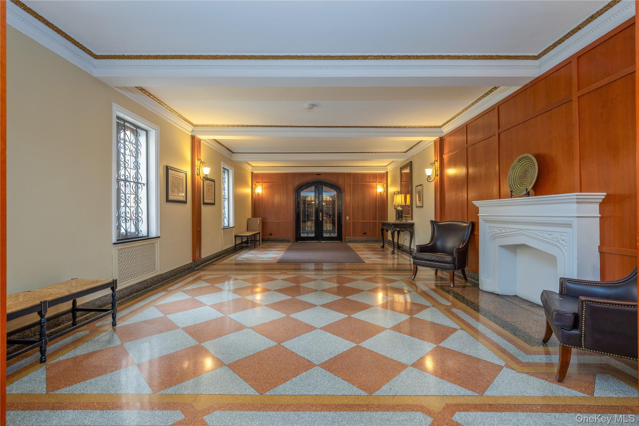 25 Parkview Avenue, Unit 2K Bronxville, NY 10708 - Photo 8 of 26 a living room with a rug and a fireplace