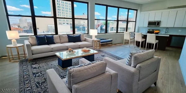 a living room with furniture and a large window