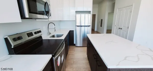 a utility room with a sink and toilet