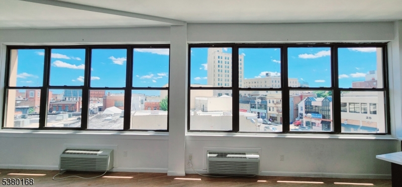 30 Howe Avenue, Unit 304 Passaic, NJ 07055 - Photo 10 of 12 a living room with large window