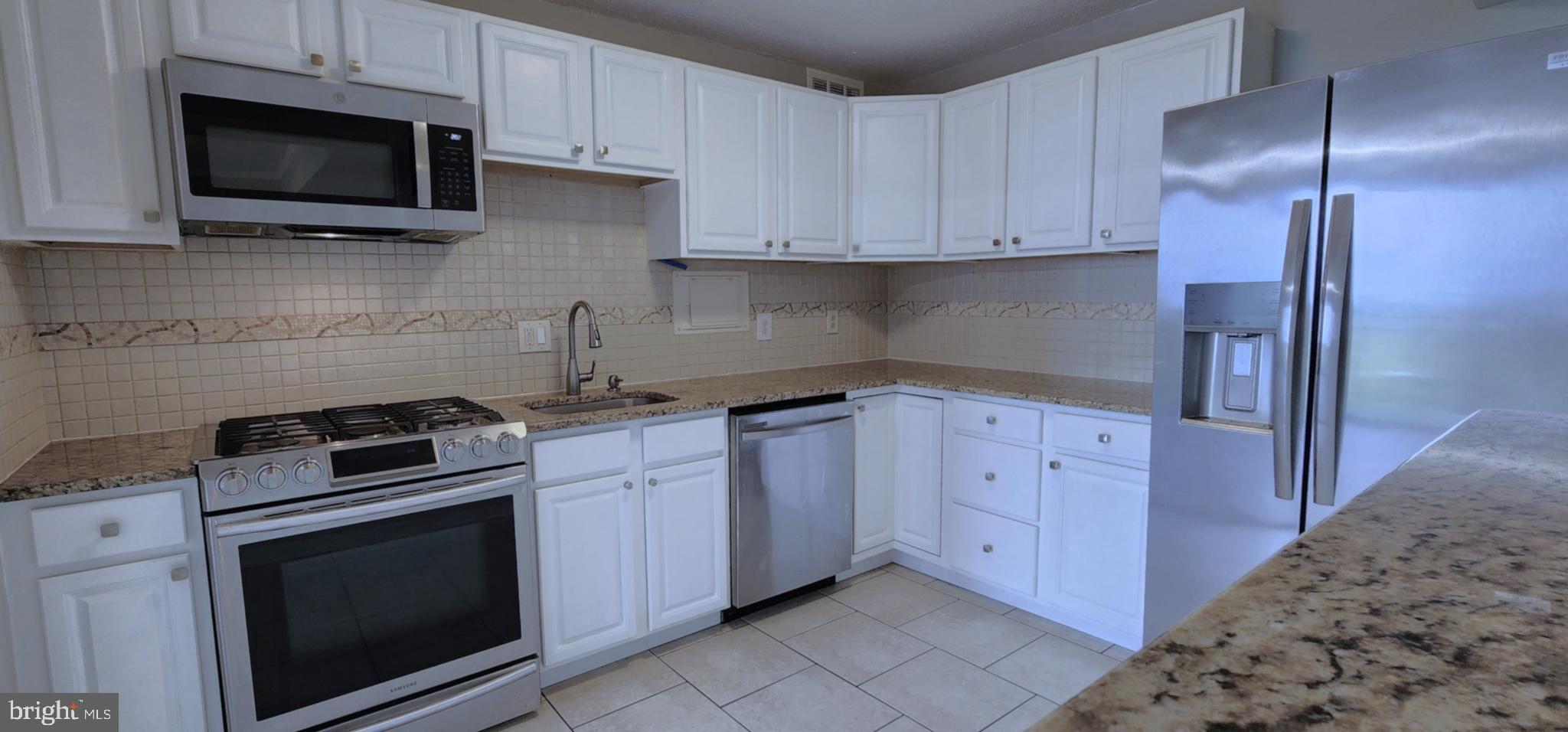 1836 Metzerott Road, Unit 1710 Adelphi, MD 20783 - Photo 9 of 33 Kitchen w/Granite C-tops & SS Appliances