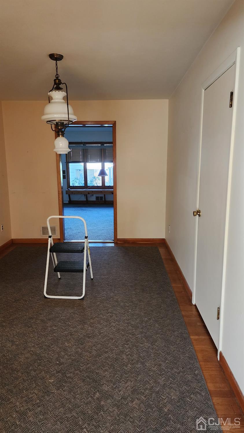 20 Middlesex Avenue Edison, NJ 08820 - Photo 20 of 28 a living room with a piano and a table